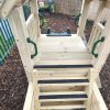 wooden climbing frame with slide